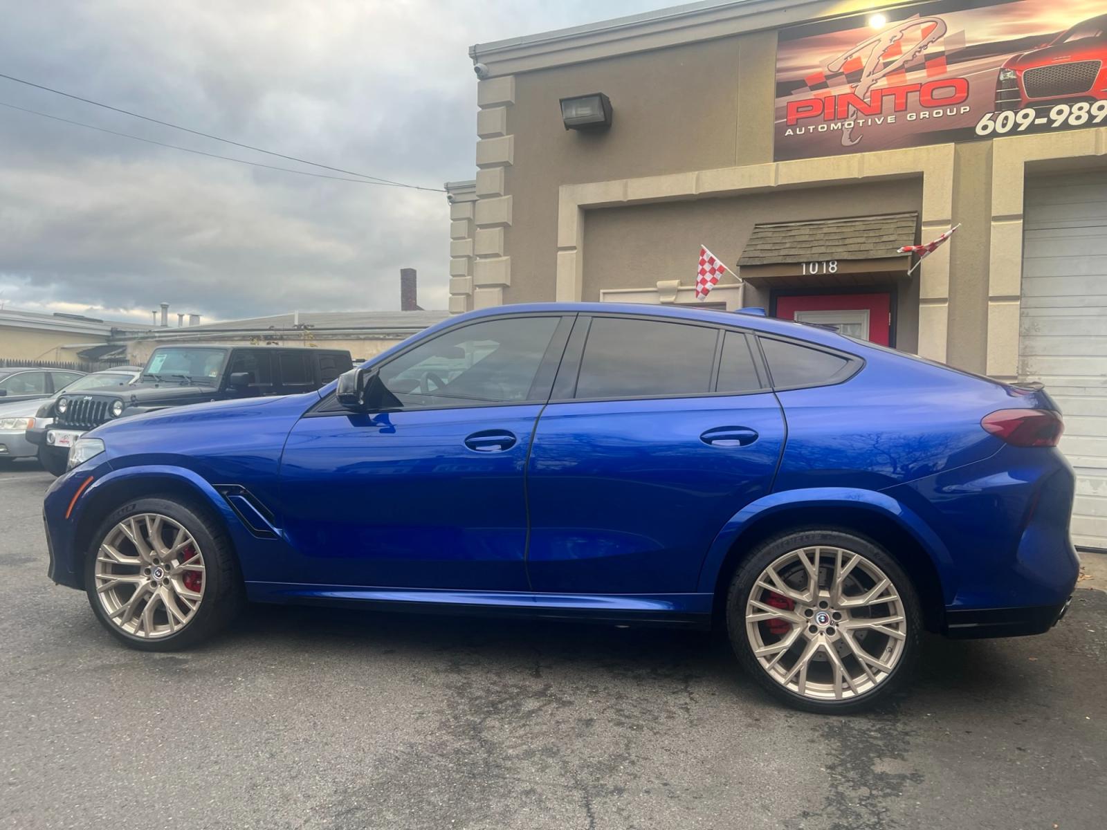 2022 Blue /Red/Black BMW X6 M Base (5YMCY0C07N9) with an 4.4L V8 DOHC 32V engine, 8A transmission, located at 1018 Brunswick Ave, Trenton, NJ, 08638, (609) 989-0900, 40.240086, -74.748085 - Holy Cow and Wow!!...That is the description on this absolutely stunning BMW X6 M Competition! Ordered by Anthony himself with the best color choice of Marina Bay Blue metallic and Red Interior to stand out on the road and to any enthusiast of the BMW X series! Executive Pkg. includes Remote Start, - Photo #29